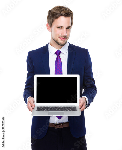 Business man show with blank screen of laptop