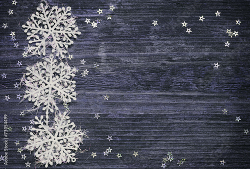 Snowflakes and stars on woo...