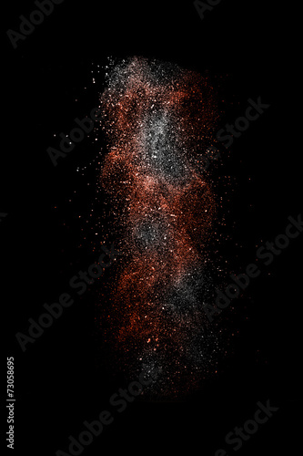 Stop motion of white and red dust explosion isolated on black ba