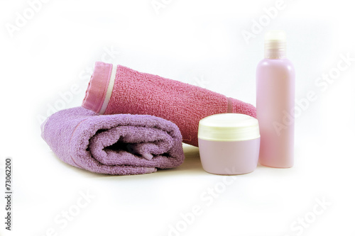 Towels and containers of creams, spa concept