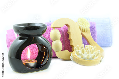 Candle, massagers and towels photo