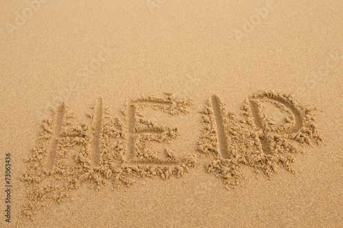 Help - Inscription on the sand of tropical beach