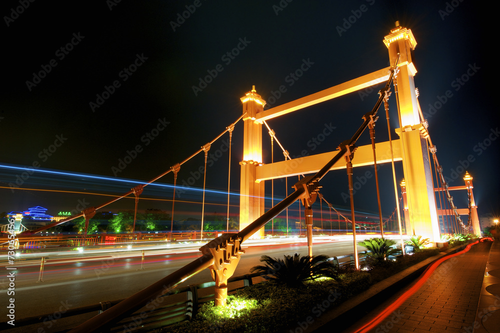 Fototapeta premium Lizhe bridge at night in Guilin, Guangxi, China.