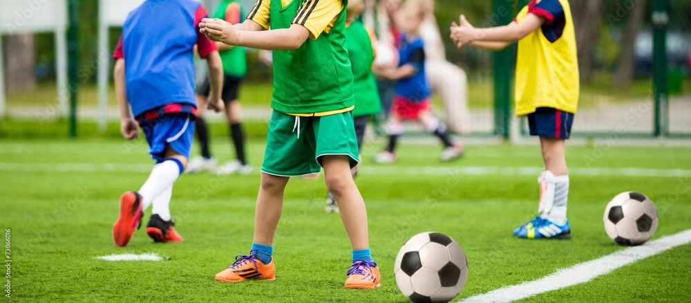 kids playing football soccer match kids playing football soccer match