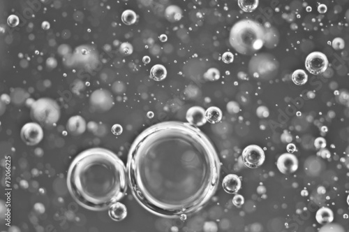 Air bubbles in water. Abstract black-and-white background. Macro