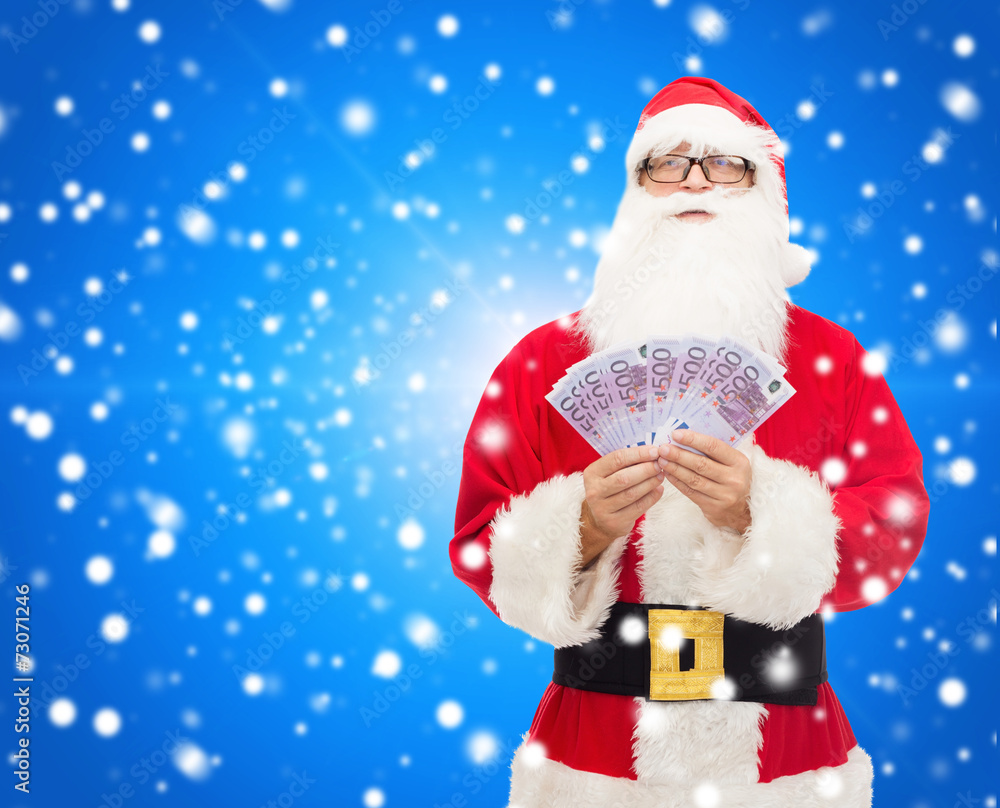 man in costume of santa claus with euro money man in costume of santa claus with euro money