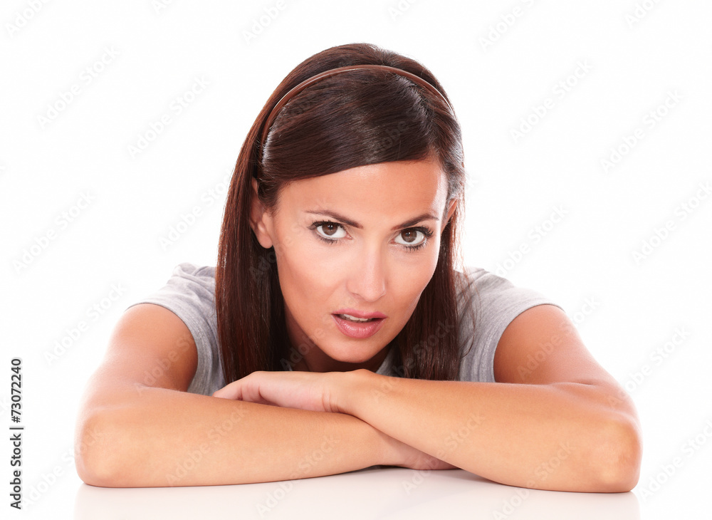 Unsmiling beautiful female looking at camera Unsmiling beautiful female looking at camera