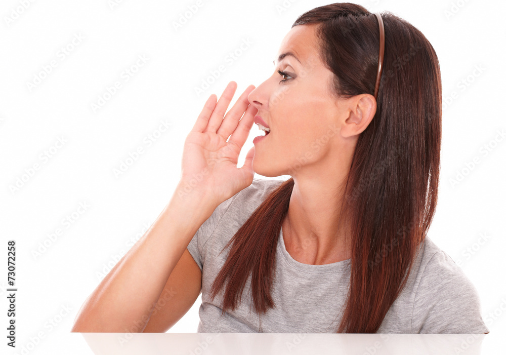 Hispanic woman conversing and looking to her right Hispanic woman conversing and looking to her right