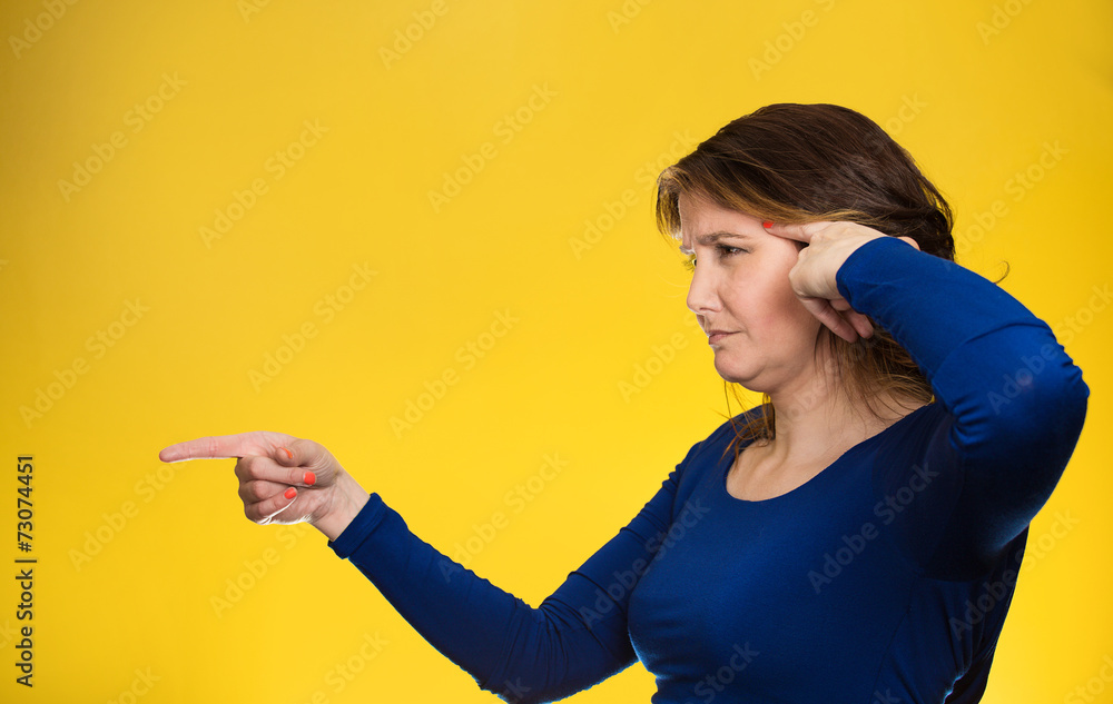 angry middle aged woman gesturing with finger are you crazy? angry middle aged woman gesturing with finger are you crazy?