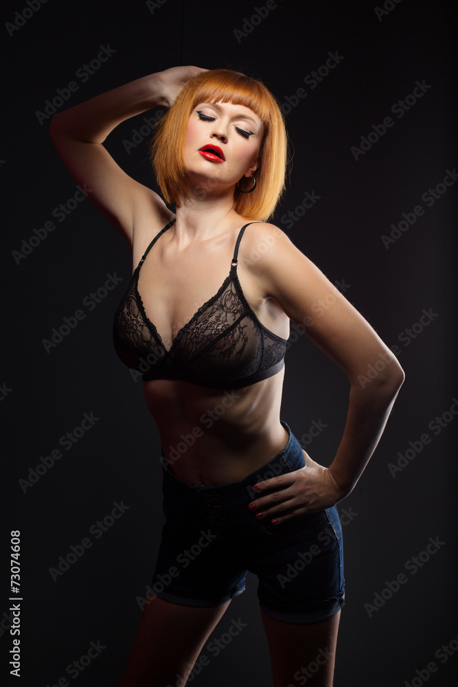 Languorous red-haired woman posing at camera Languorous red-haired woman posing at camera