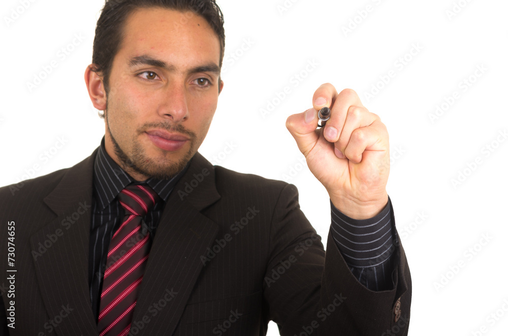 young handsome businessman writing on whiteboard with marker young handsome businessman writing on whiteboard with marker