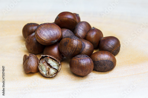Chestnut on wood background.