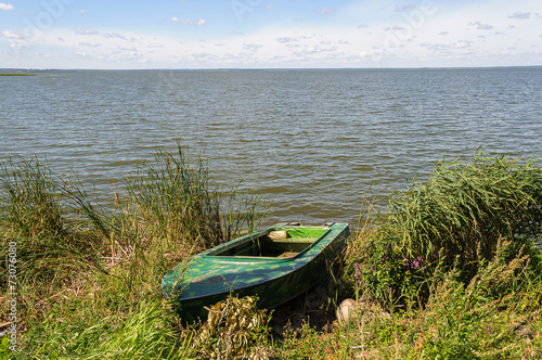 Duralumin fishing boat on the lake photo