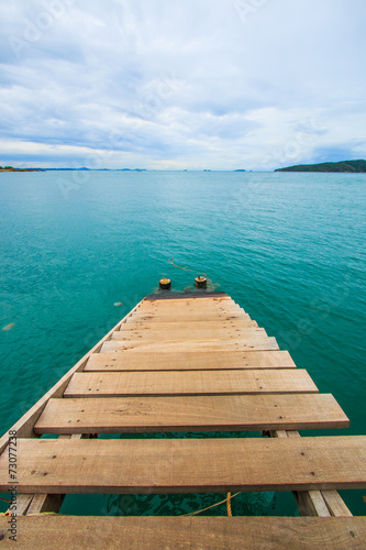 Wooden bridge into the sea