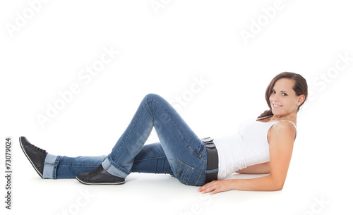 Attractive girl lying on the floor. All on white background.