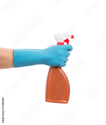 Hand holding brown plastic spray bottle.