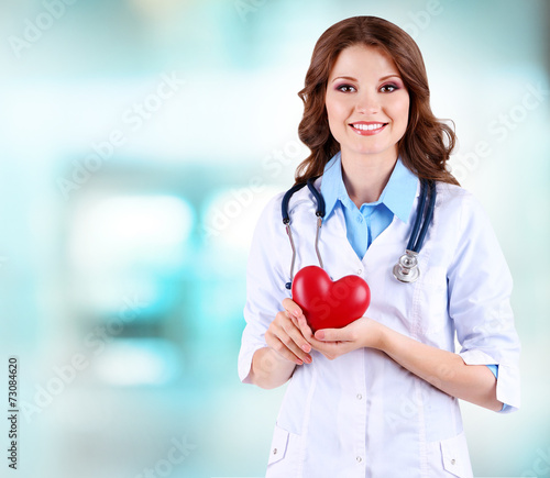 Young beautiful doctor hold...