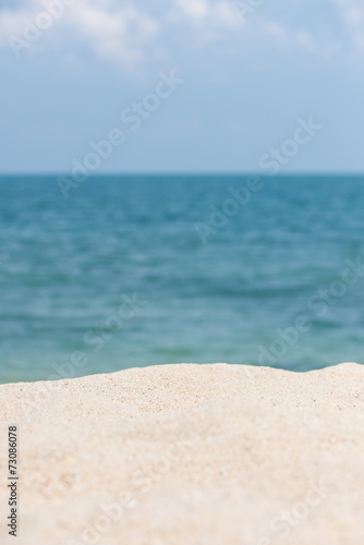 Sandy beach with horizon over blue sea background