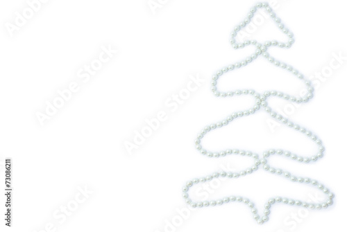 White pearls on a white background in the form of spruce