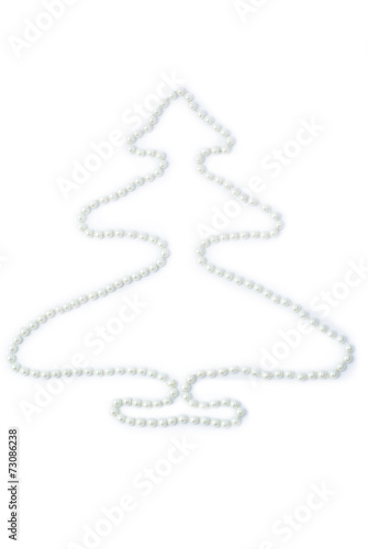 White pearls on a white background in the form of spruce