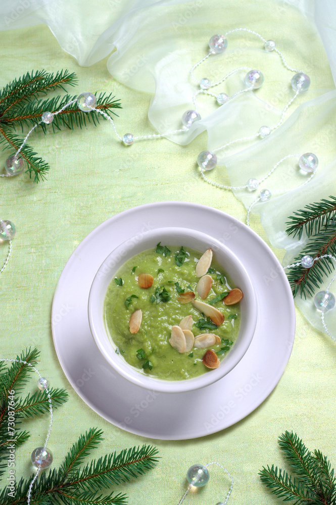 Christmas pea soup with toasted almonds - obrazy, fototapety, plakaty 