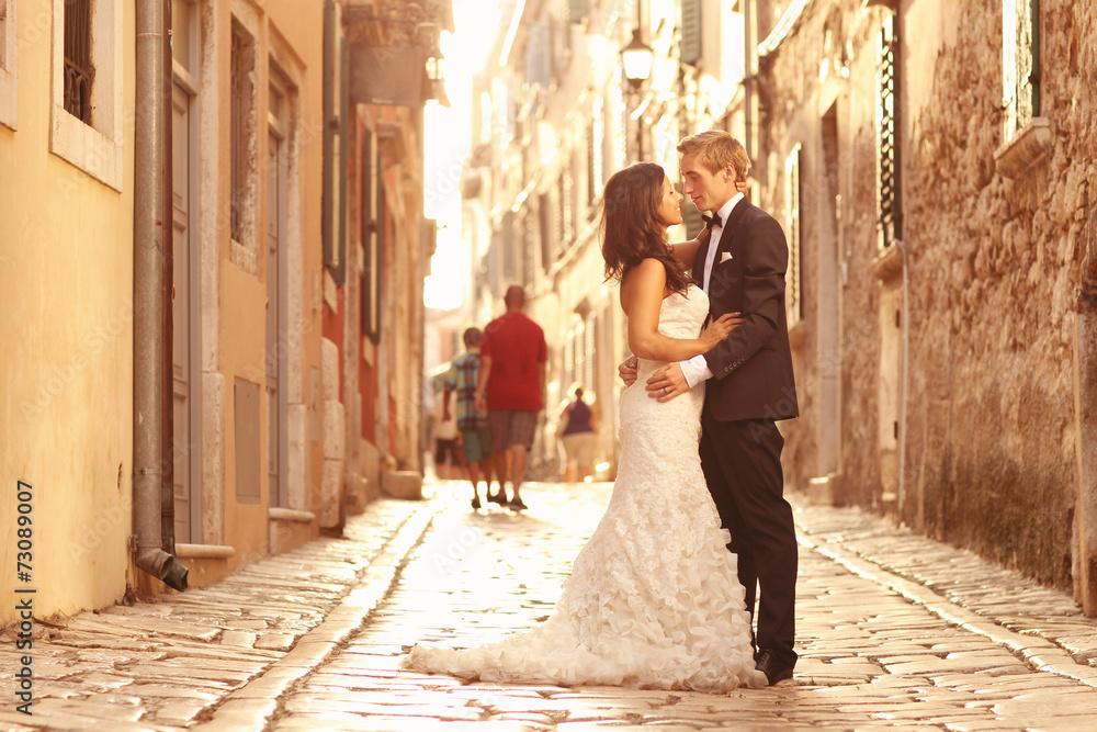 Beautiful bridal couple at sunset on the streets of Venice Beautiful bridal couple at sunset on the streets of Venice