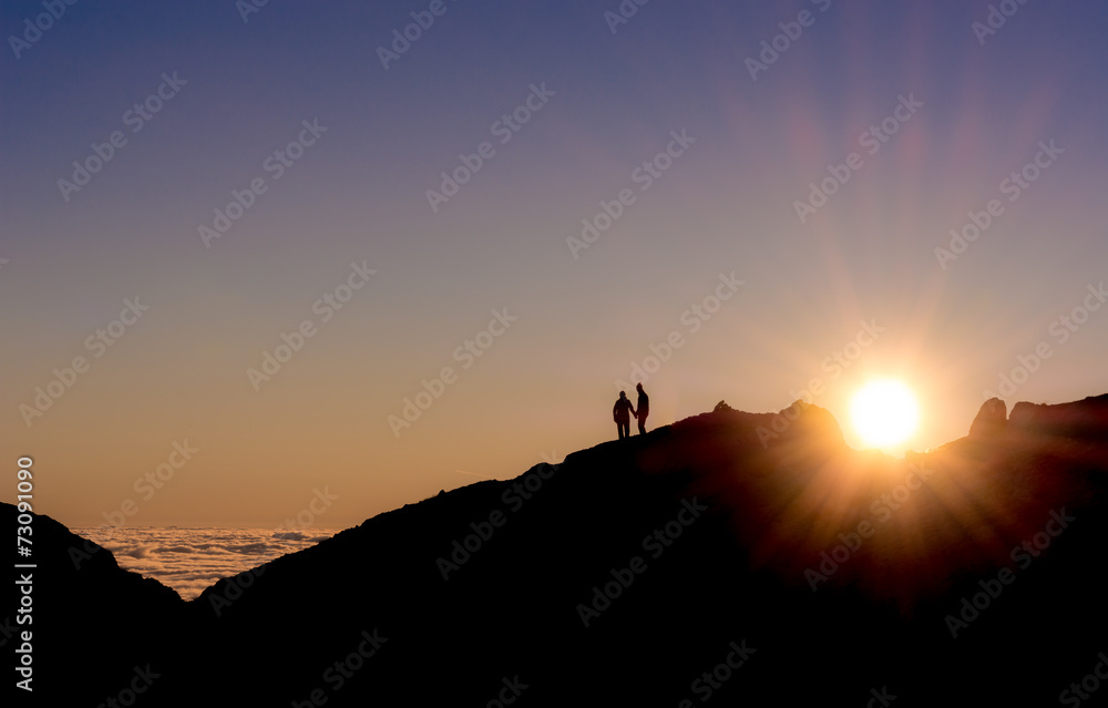 silhouette of a couple holding hands
