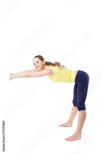 girl doing stretching exercises sitting on the floor