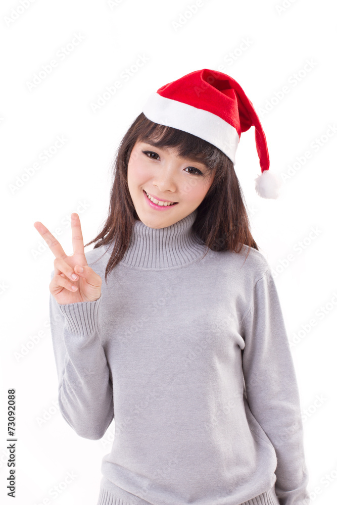 happy, smiling woman wearing X'mas santa hat, showing v sign happy, smiling woman wearing X'mas santa hat, showing v sign