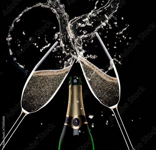 Champagne flutes on black background