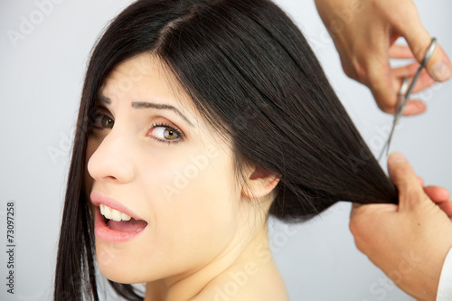 Woman surprised about getting long hair cut