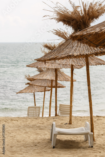 Fototapeta Naklejka Na Ścianę i Meble -  Beach umbrella made of straw