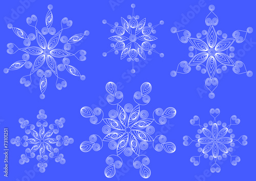 Snowflakes in the technique of quilling .