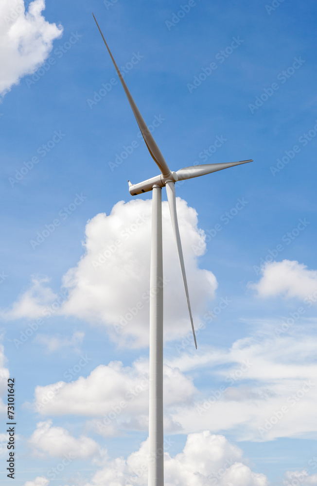 Closeup of wind turbine producing alternative energy in wind far Closeup of wind turbine producing alternative energy in wind far