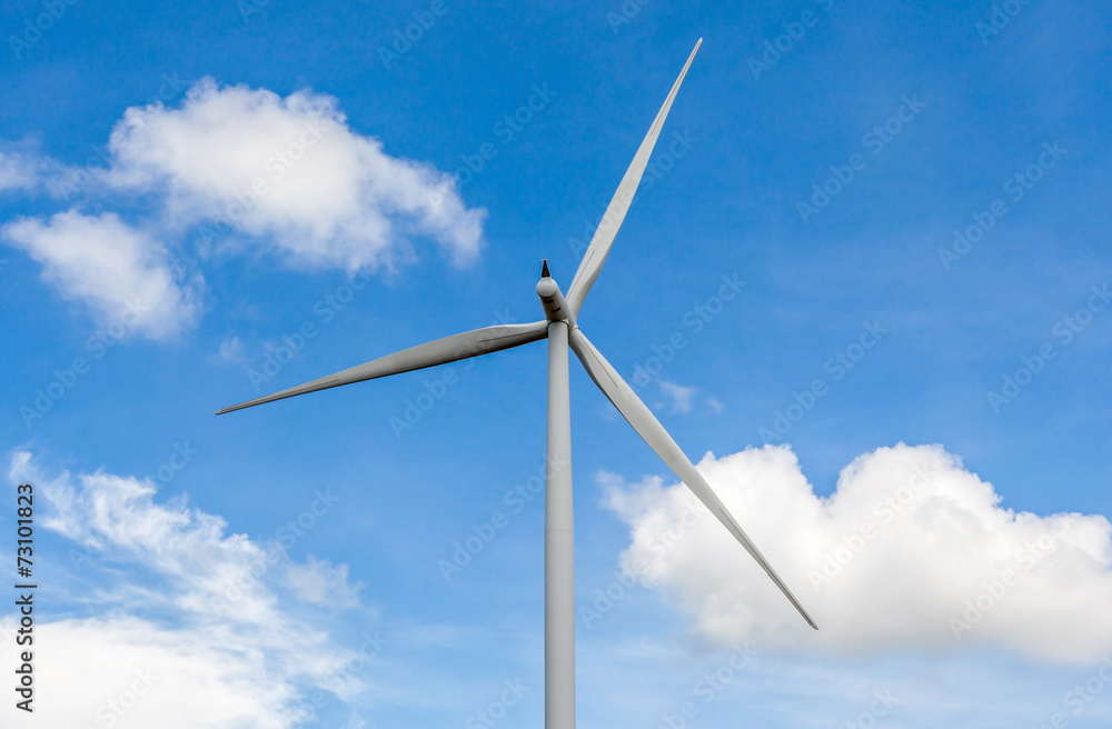 From the behind of wind turbine in beautiful cloudy blue sky bac From the behind of wind turbine in beautiful cloudy blue sky bac