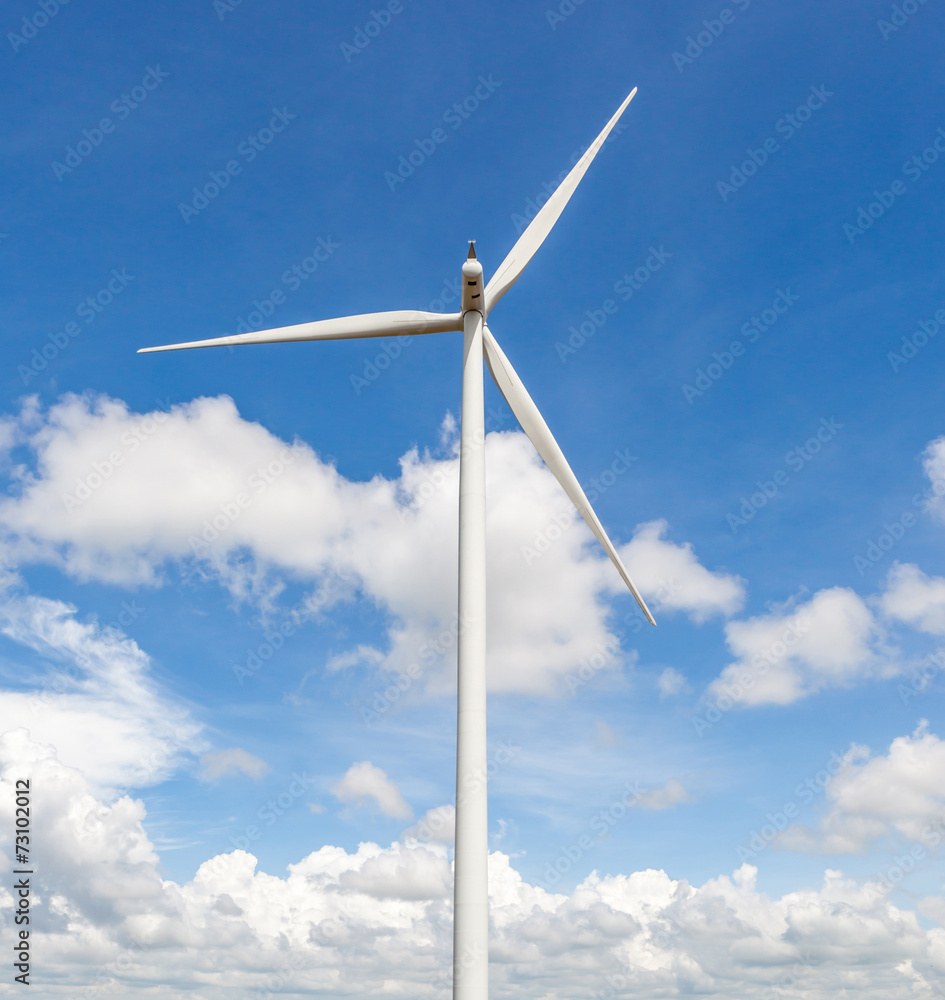 The wind turbine in beautiful cloudy blue sky background in wind The wind turbine in beautiful cloudy blue sky background in wind