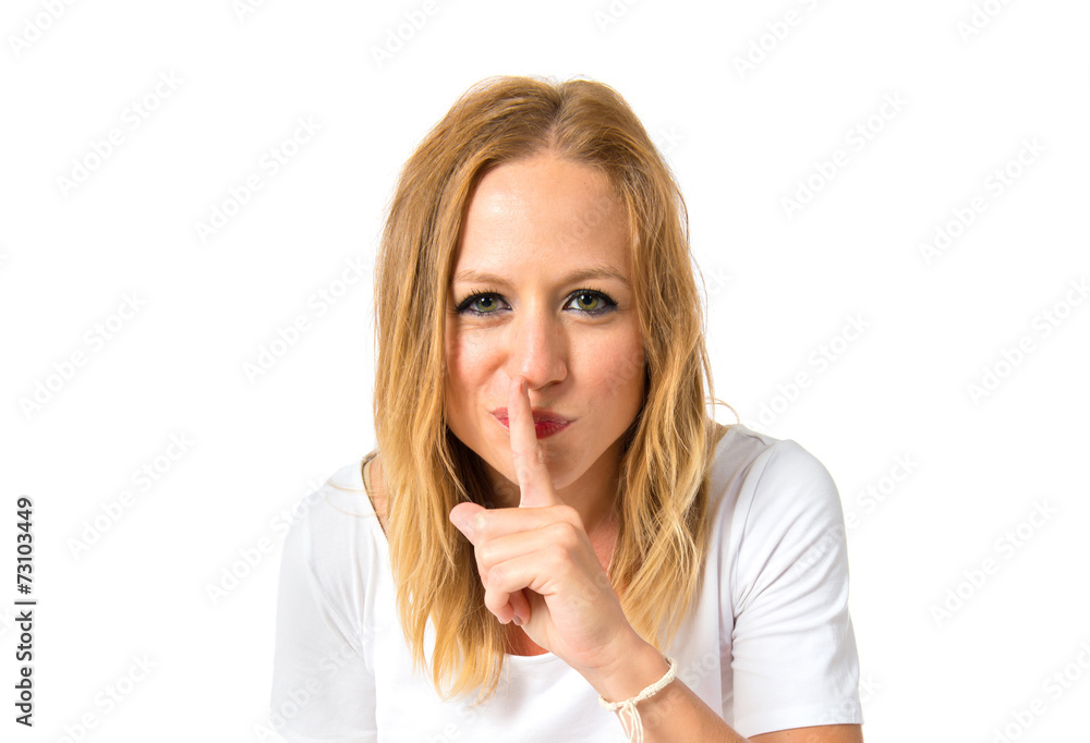 Girl making silence gesture over isolated white background Girl making silence gesture over isolated white background