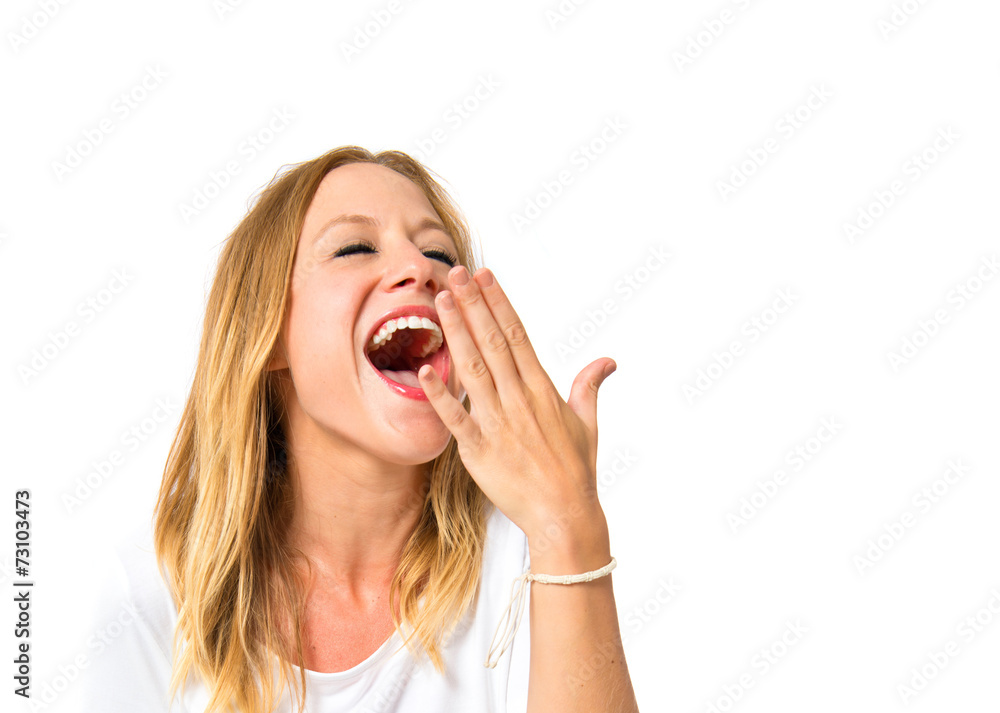 Cute girl yawning over isolated white background Cute girl yawning over isolated white background