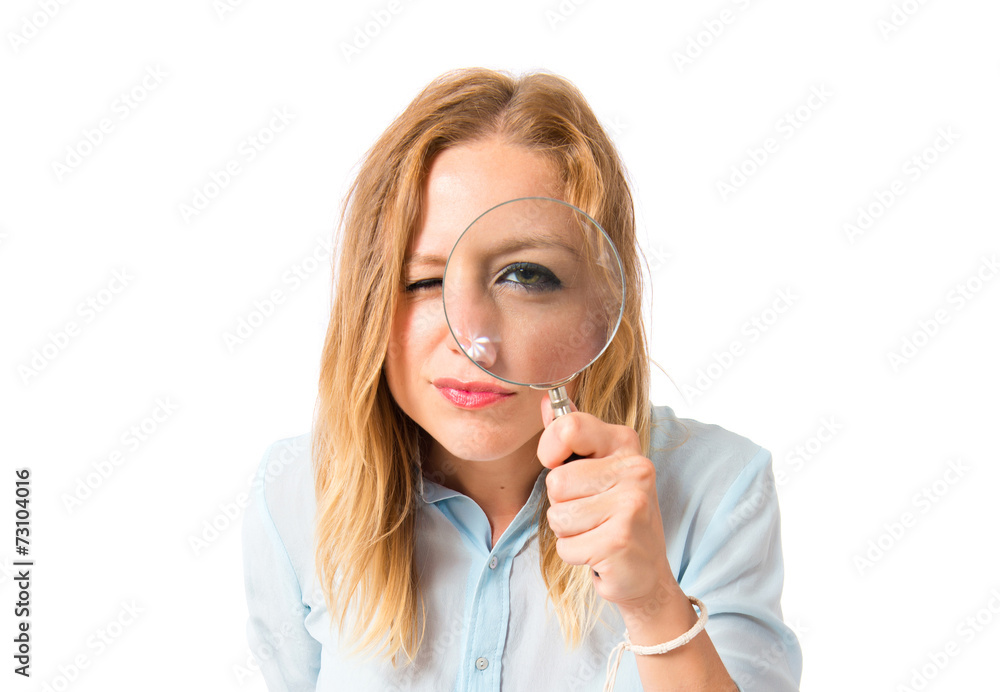 Girl with magnifying glass over white background Girl with magnifying glass over white background