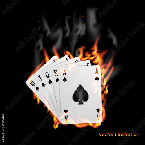 Poker cards burn in the fire.
