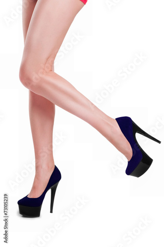 Perfect female legs wearing high heels