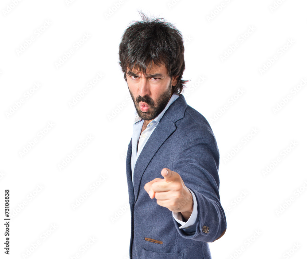Angry man pointing somebody over isolated white background Angry man pointing somebody over isolated white background