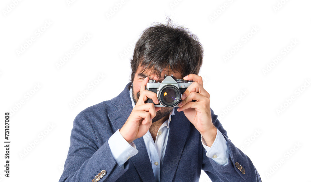Man photographing over white background Man photographing over white background