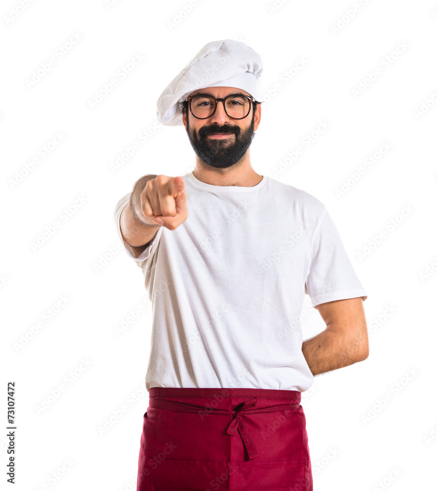 Chef pointing to the front over white background Chef pointing to the front over white background