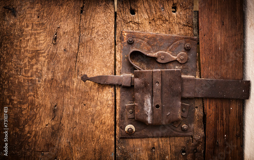 Old lock of a wooden door's Trullo in Alberobello.