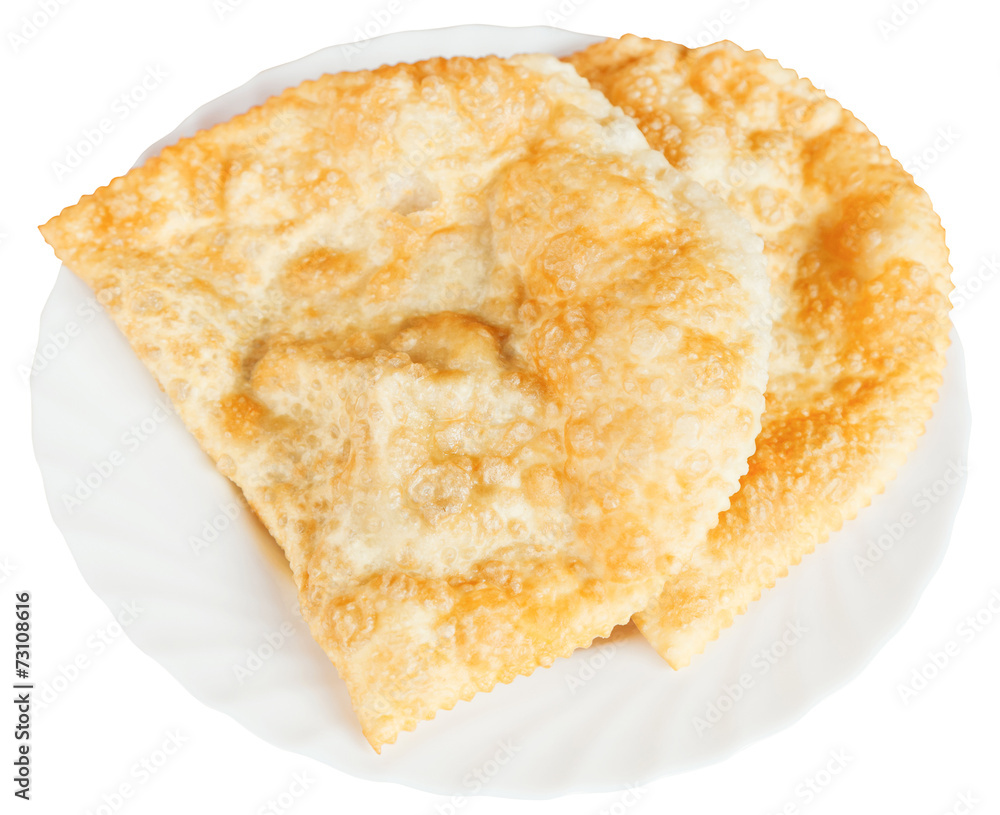cheburek pastry on white plate isolated cheburek pastry on white plate isolated
