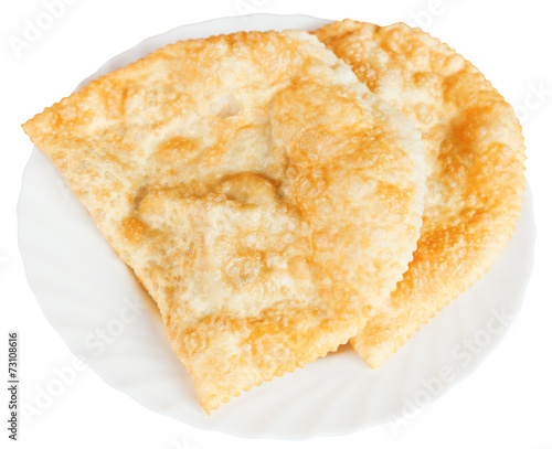 cheburek pastry on white plate isolated photo