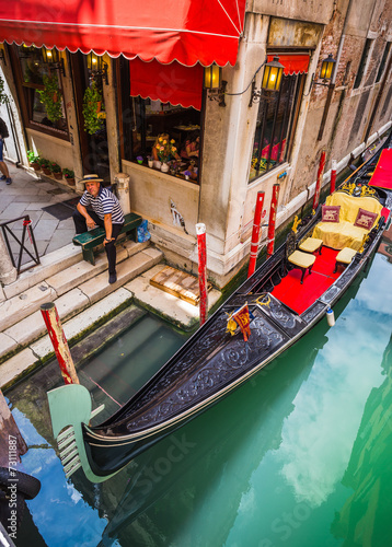 Tourists travel on gondolas at canal © Oleg Zhukov