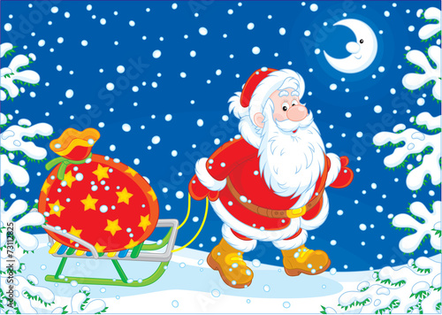 Santa carrying a bag of Christmas gifts on a sledge