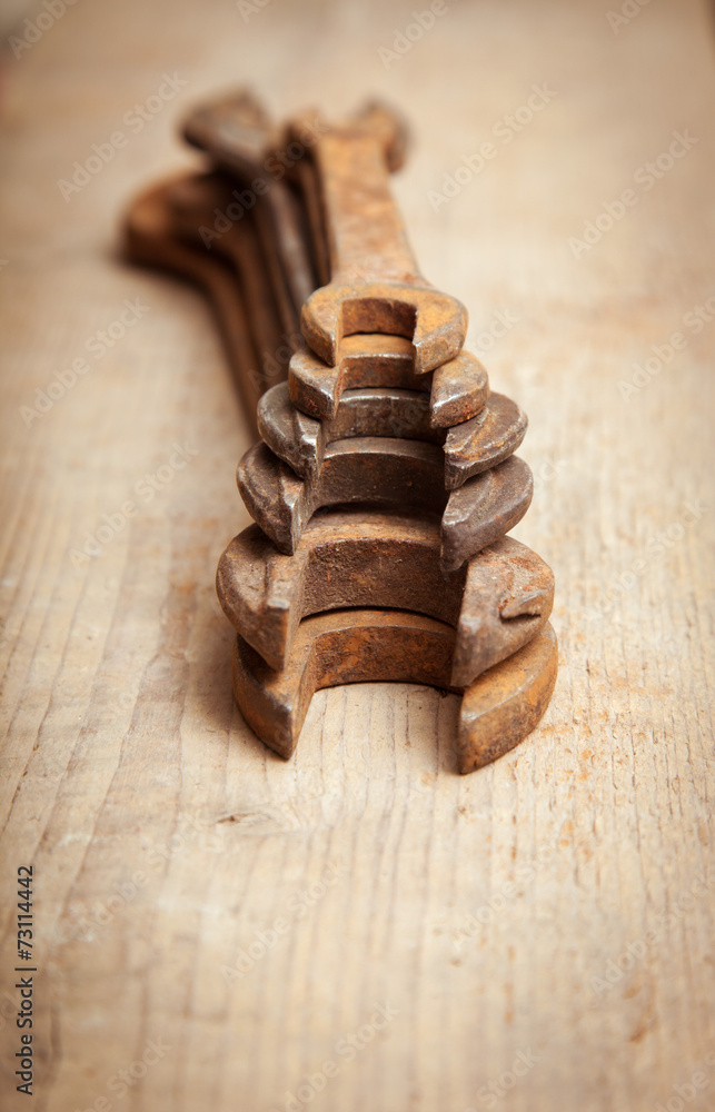 rusty wrenches on a wooden background 3 rusty wrenches on a wooden background 3